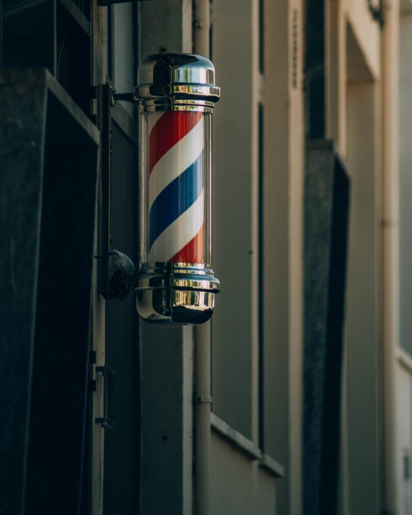 Traditional barber pole in Proença-a-Nova. Symbol of barbershop heritage.